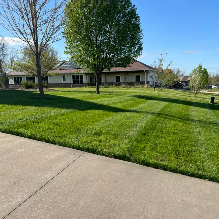 well cut grass around house with solar panels